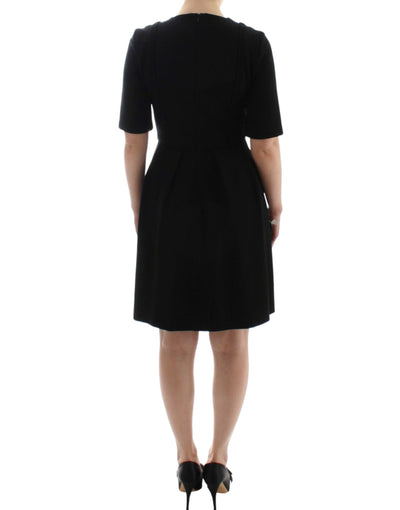 CO|TE Schwarzes kurzärmeliges Venuskleid