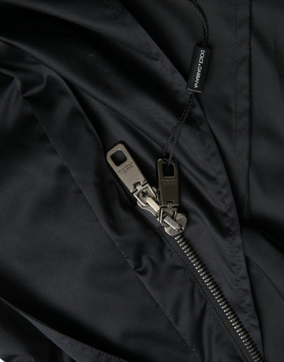 Dolce & Gabbana Schwarze lange Windbreaker-Jacke mit Kapuze aus Polyester