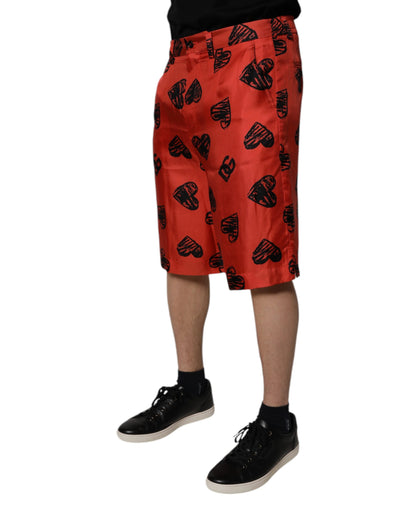 Dolce & Gabbana Orangefarbene Bermuda-Shorts mit Herz aus Seide