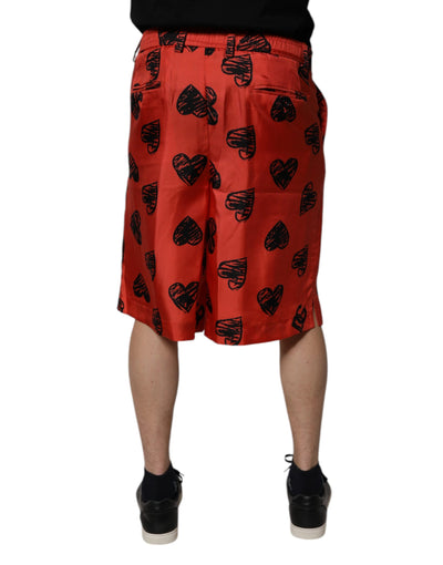 Dolce & Gabbana Orangefarbene Bermuda-Shorts mit Herz aus Seide